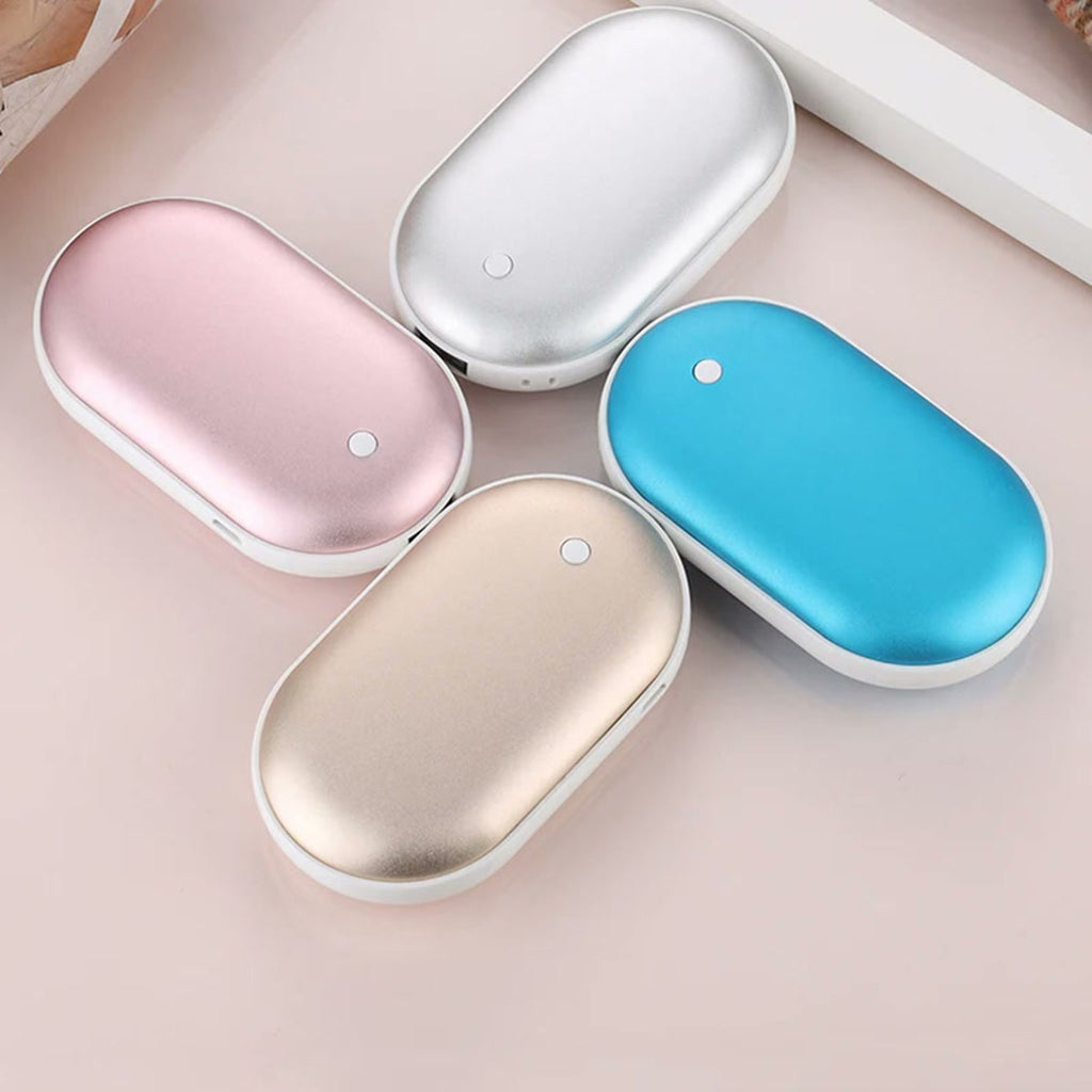 Chauffe-mains rechargeables rose, argent, bleu et or ; le bleu n’est pas proposé
