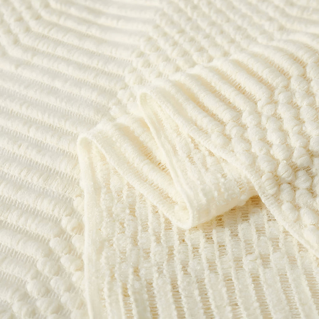 Plaid tricoté écru, texture gaufrée et franges